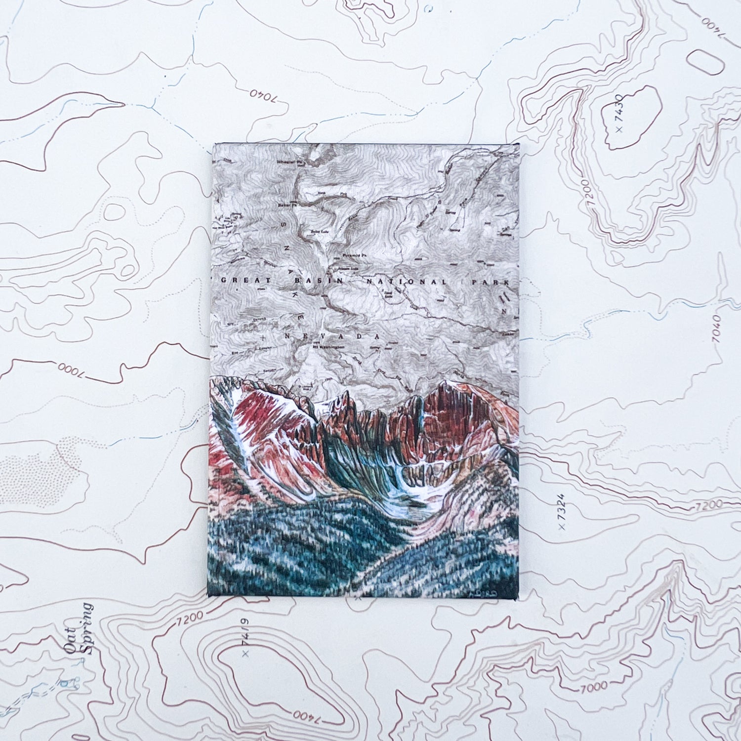 a final switchback button magnet featuring Katie Jeanne Reim's  great basin wheeler print