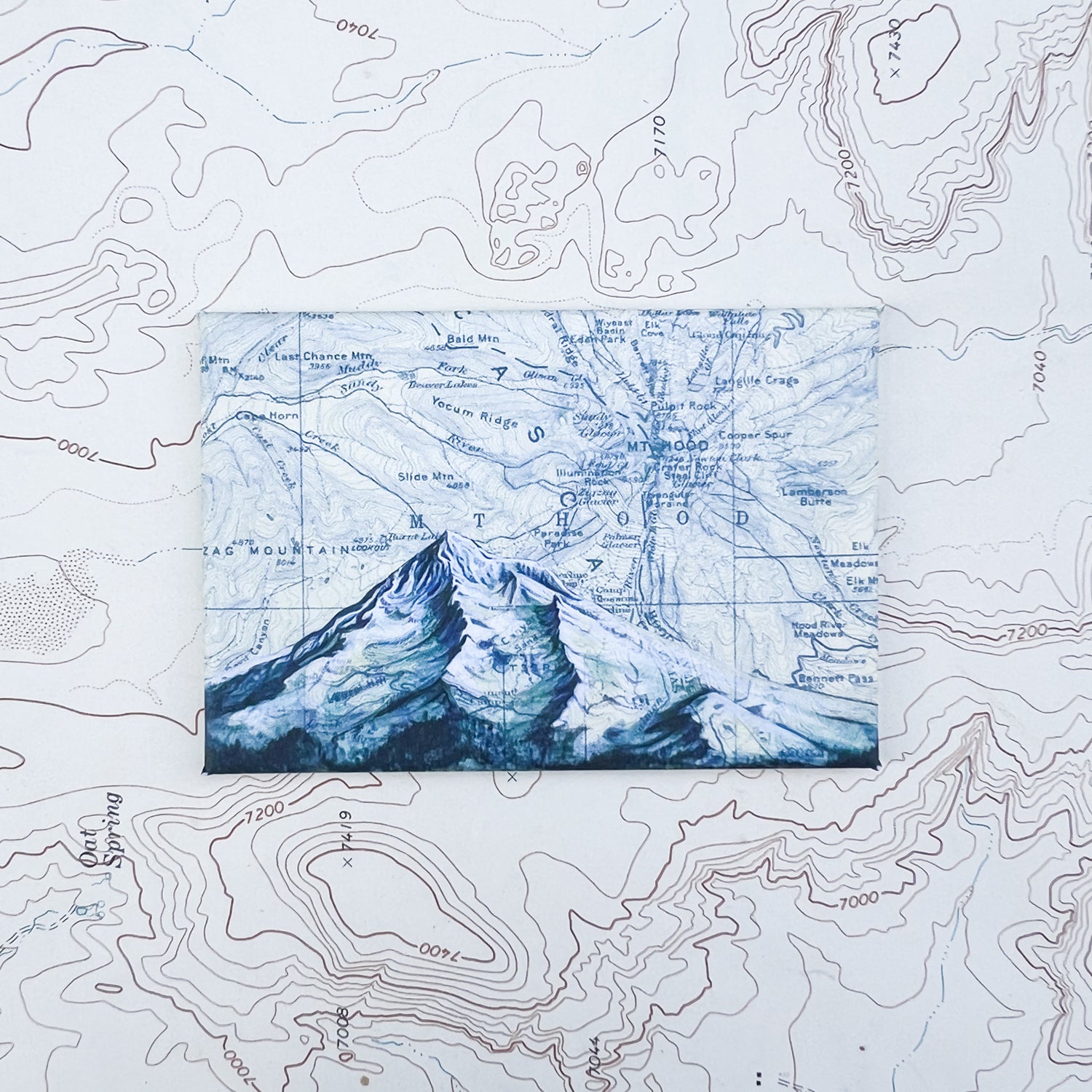 a final switchback button magnet featuring Katie Jeanne Reim's mount hood blue print