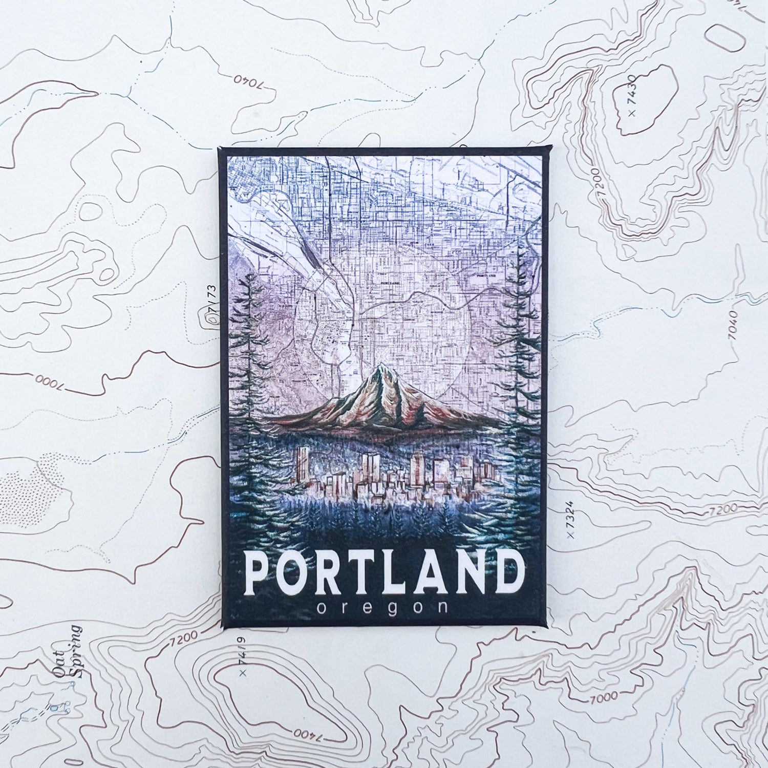 a final switchback button magnet featuring Katie Jeanne Reim's portland glow print