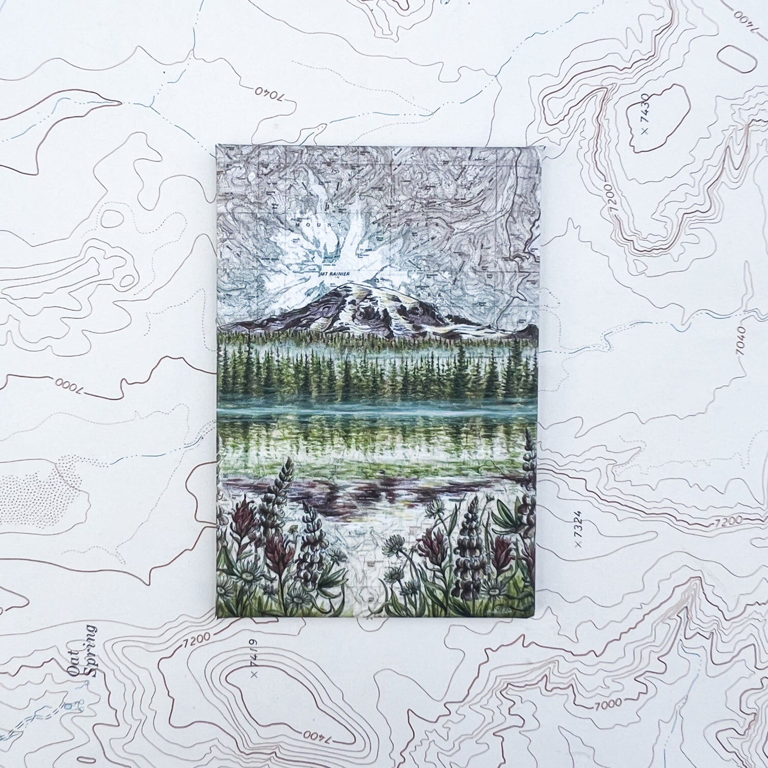 a final switchback button magnet featuring Katie Jeanne Reim's mount rainier reflections print