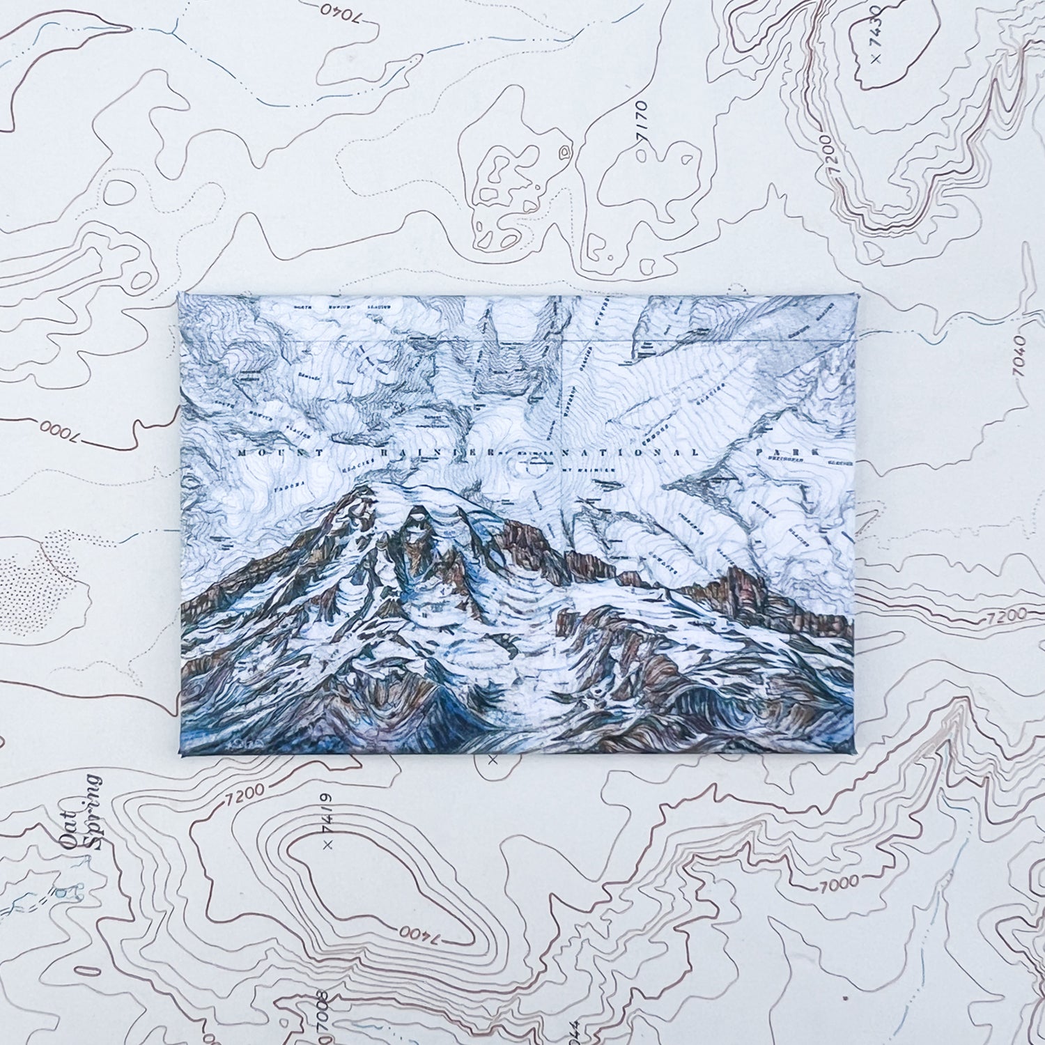 a final switchback button magnet featuring Katie Jeanne Reim's mount rainier summit print