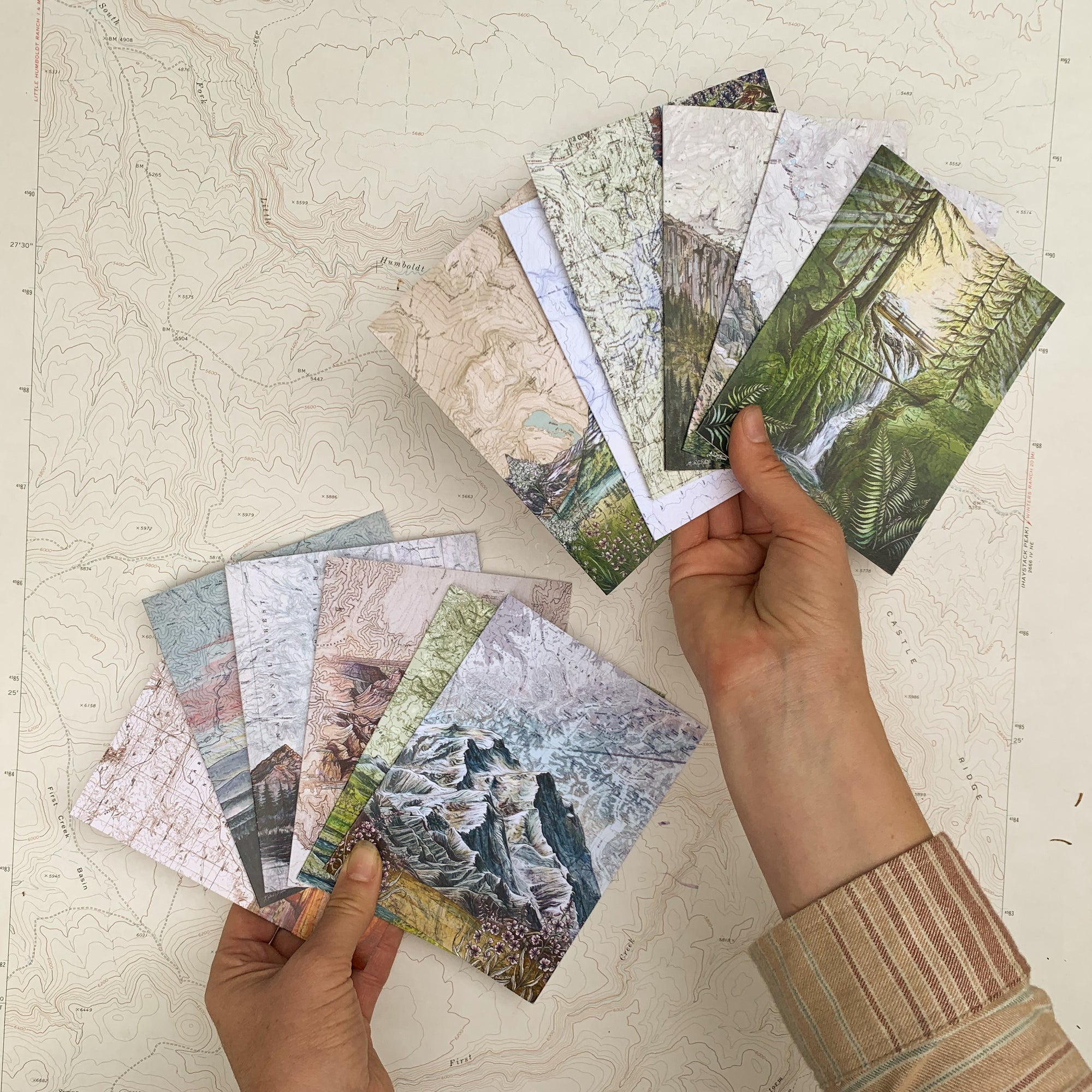 artist Katie Jeanne Reim holding final switchback greeting card featuring her prints