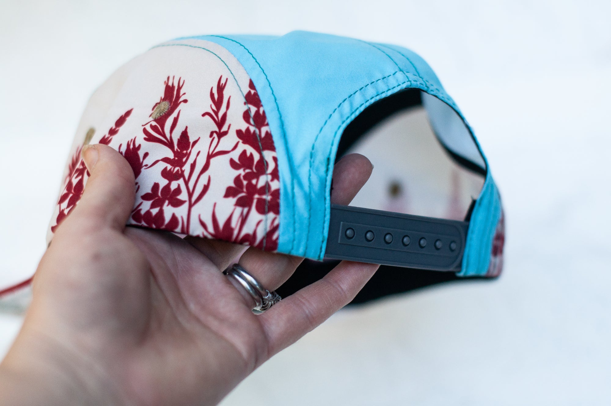 back view of the final switchback 5-panel trail hat featuring artist Katie Jeanne Reim&#39;s Paintbrush print