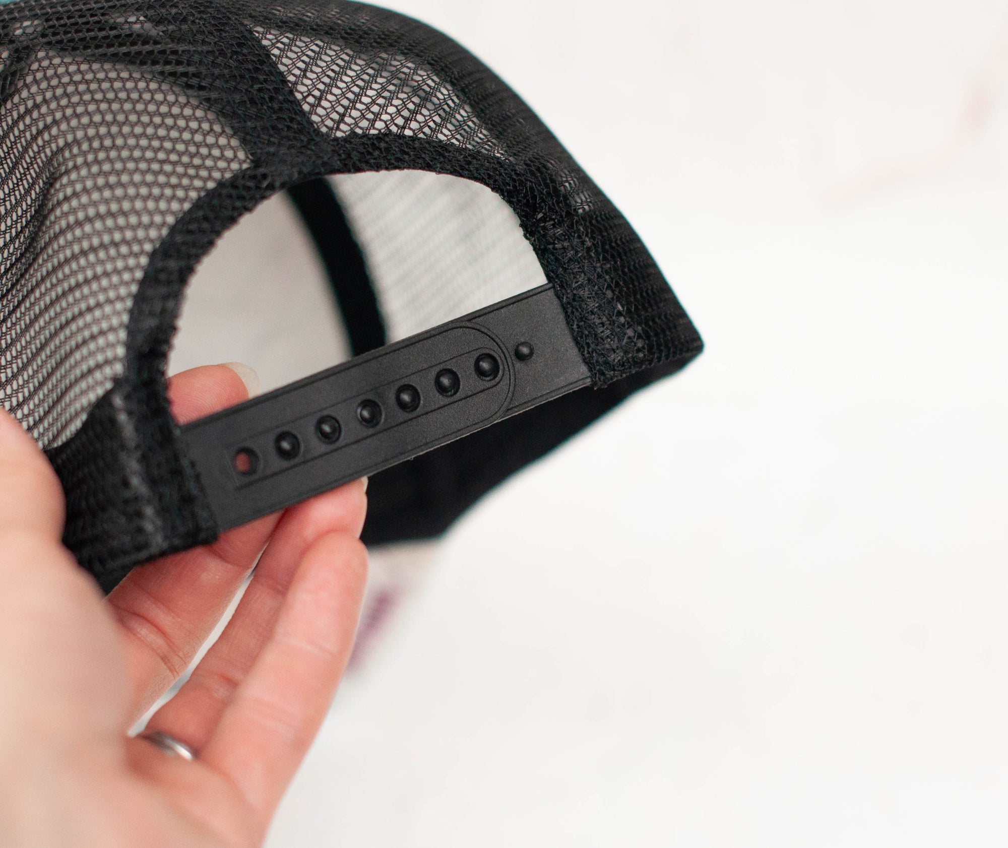 back view of the final switchback trucker hat featuring artist Katie Jeanne Reim&#39;s paintbrush print