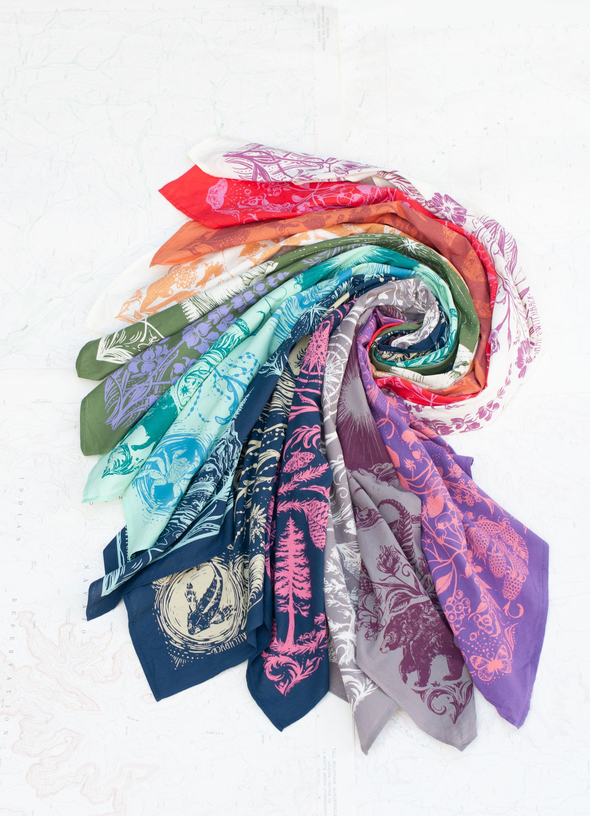 a variety of final switchback bandanas featuring Katie Jeanne Reim's prints
