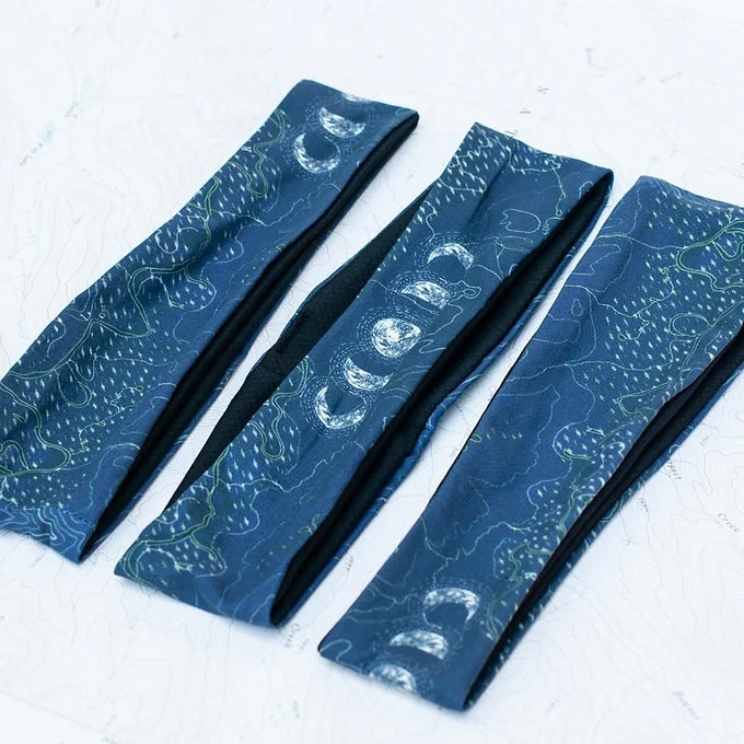 3 final switchback quick dry headbands featuring artist Katie Jeanne Reim's milkyway print