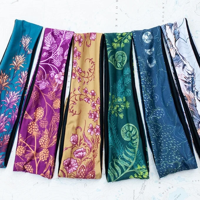 a collection of final switchback quick dry headbands featuring artist Katie Jeanne Reim&#39;s prints