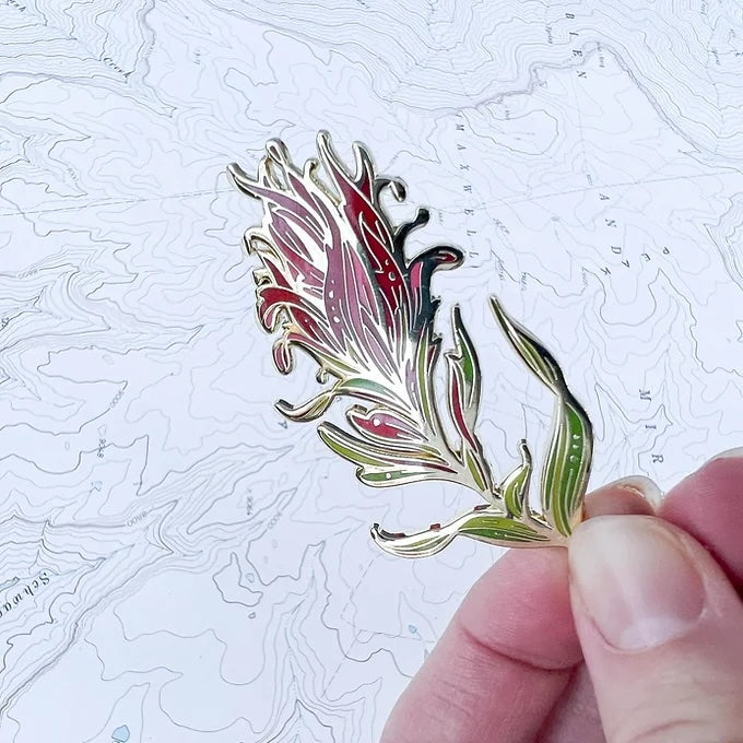 final switchback red paintbrush enamel pin created by artist Katie Jeanne Reim