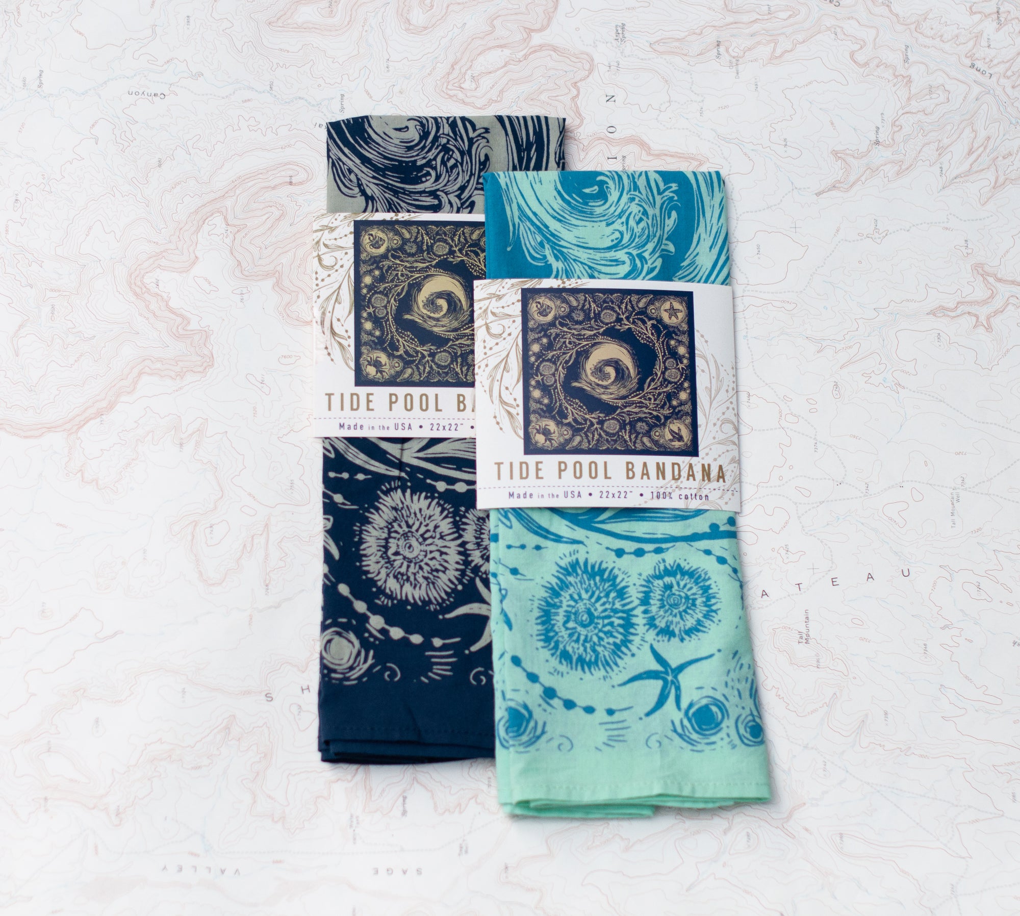 two final switchback cotton bandanas in tide pool blue and tidepool mint featuring artist Katie Jeanne Reim&#39;s prints