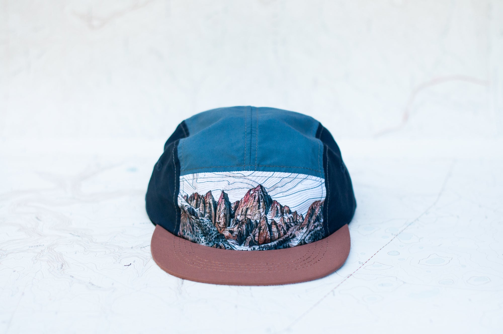 front view of the final switchback 5-panel trail hat featuring artist Katie Jeanne Reim&#39;s Whitney print