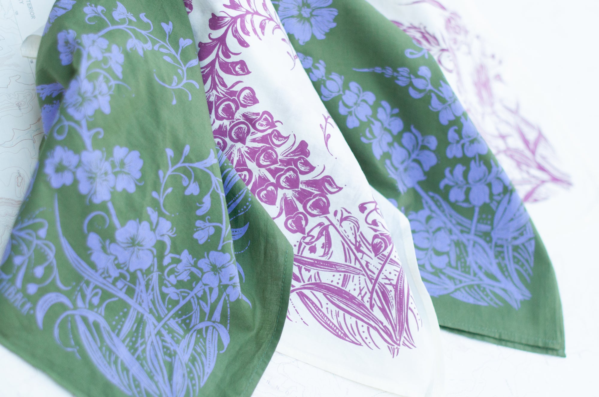 A collection of final switchback cotton bandanas featuring prints by artist Katie Jeanne Reim