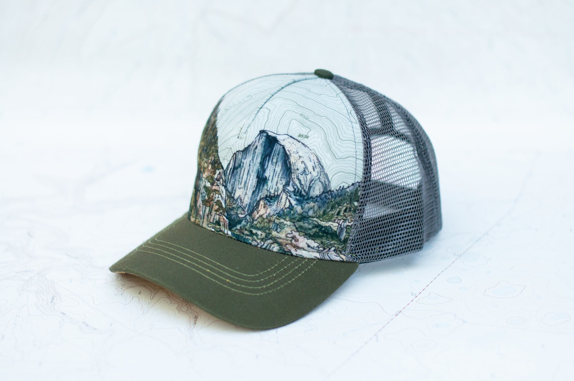 angle view of the final switchback trucker hat featuring artist Katie Jeanne Reim's Yosemite print