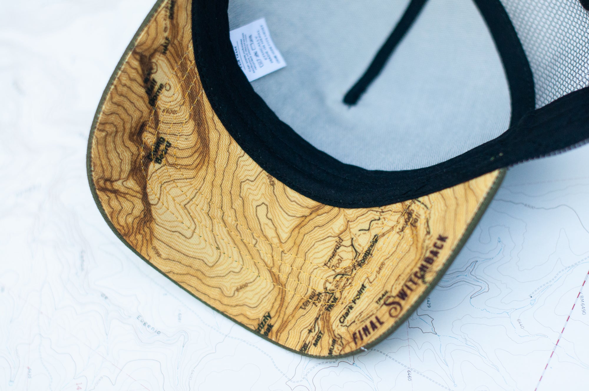 brim view of the final switchback trucker hat featuring artist Katie Jeanne Reim&#39;s Yosemite print