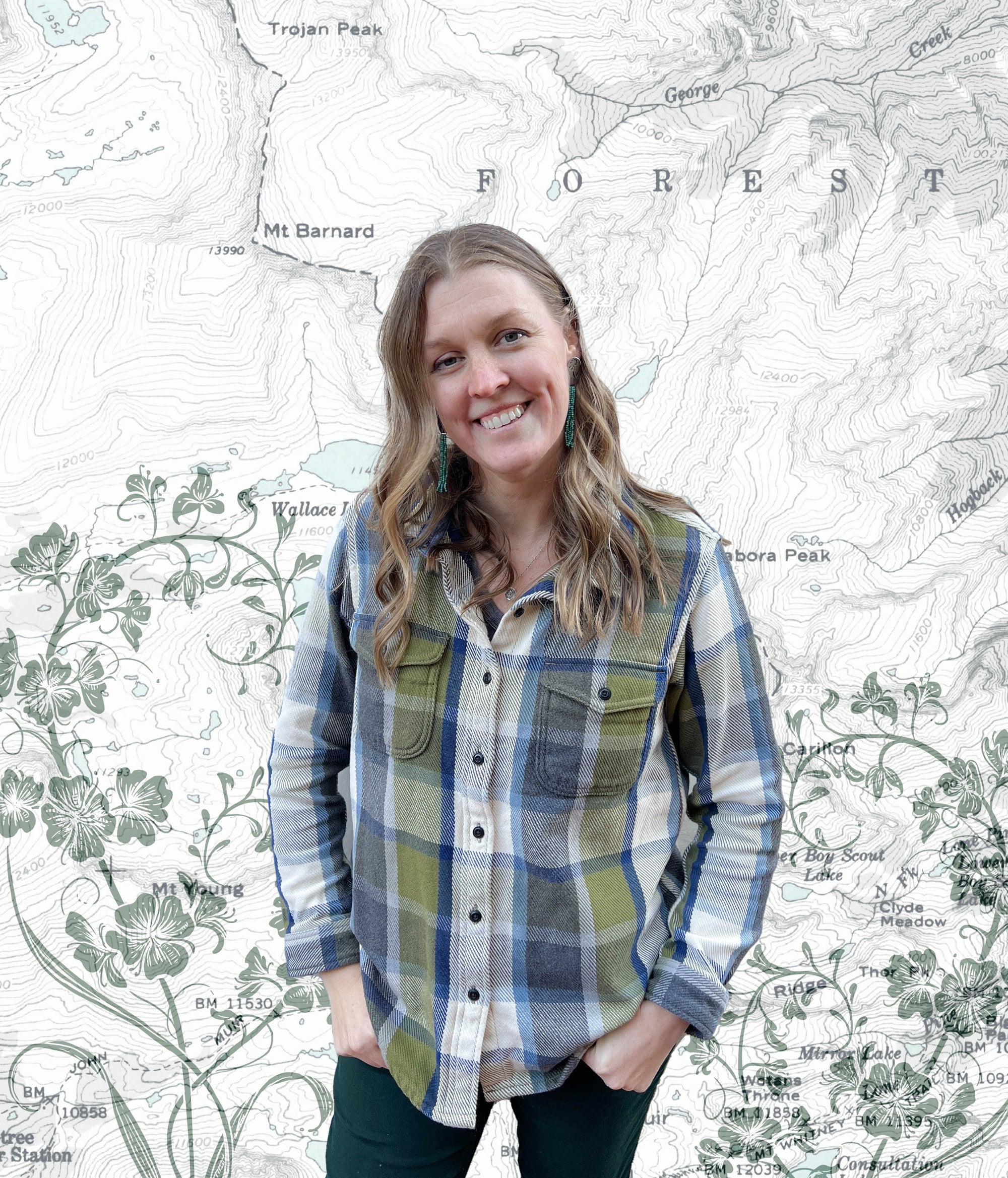 Katie Reim, outdoor and nature-inspired artist from Final Switchback standing in front of an art piece with lines on topography maps