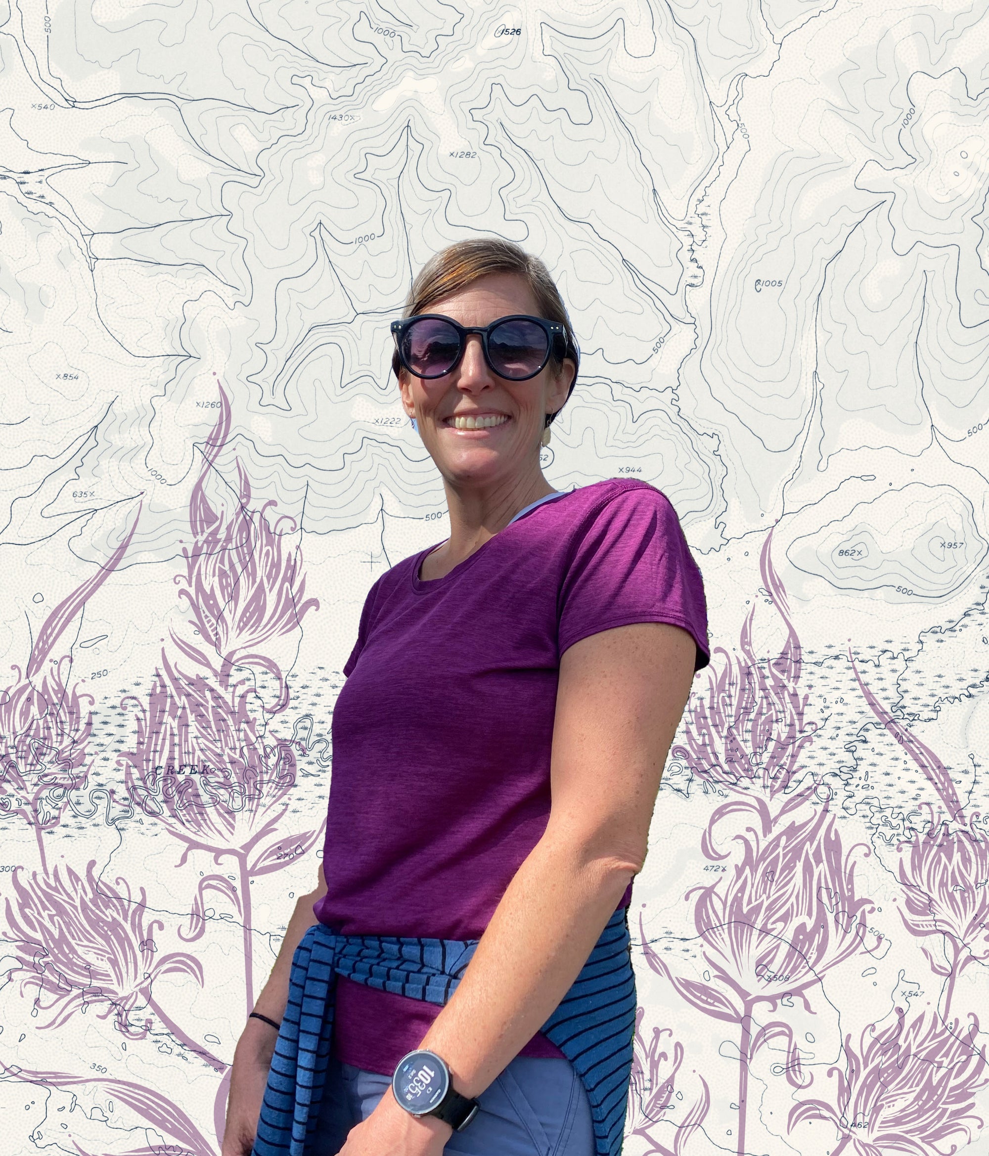 Liz Dome from Final Switchback standing in front of an art piece with lines on topography maps