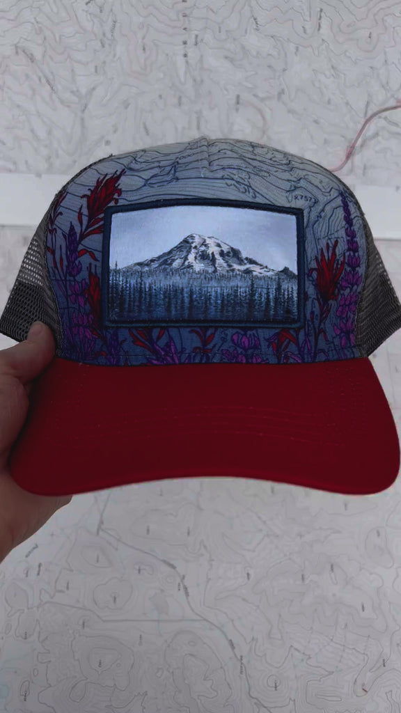 mount rainier meadow full panel twill hat by final switchback featuring Katie Reim's art video