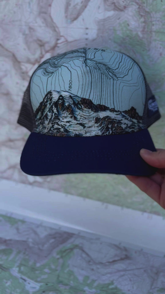 mount rainier summit trucker hat by final switchback featuring Katie Reim's art video